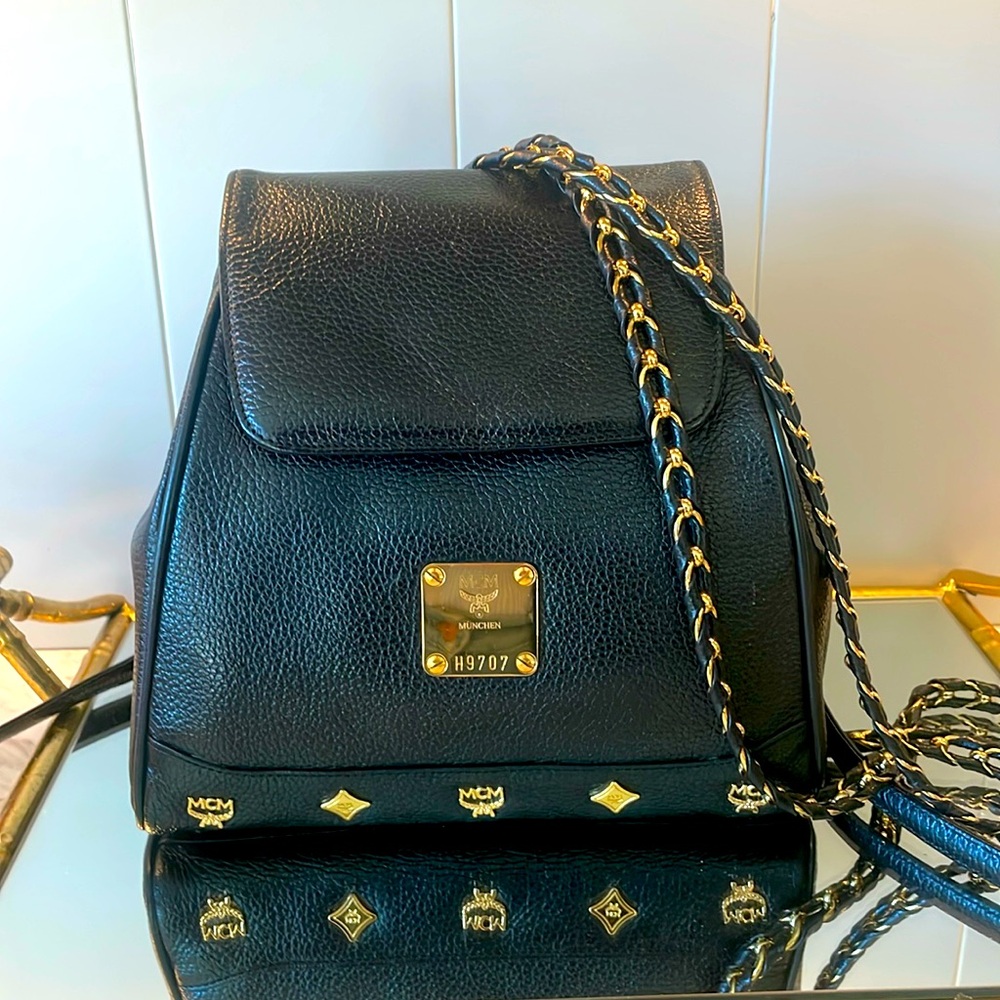 MCM Munchen black leather and gold backpack. Like New